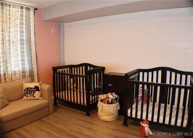 bedroom with wood finished floors