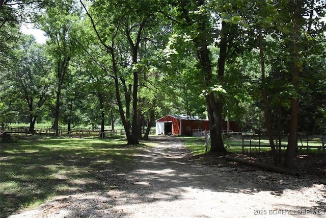 exterior space with an outbuilding and driveway