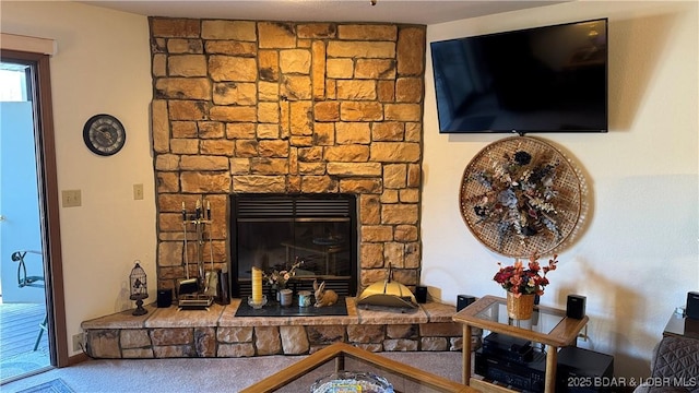 living area featuring a fireplace and carpet floors