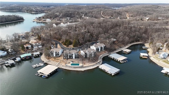 aerial view featuring a view of trees and a water view