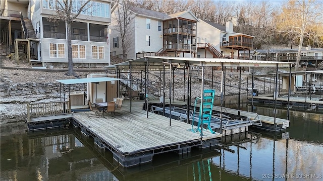 dock area with stairs and a water view