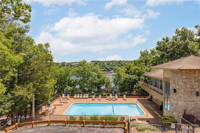 pool featuring a patio and fence