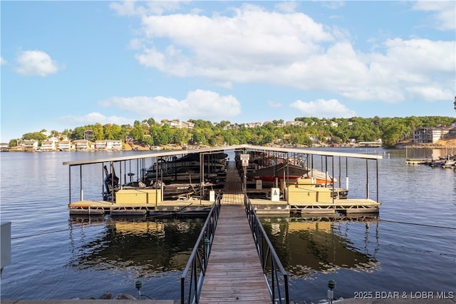 dock area with a water view and boat lift