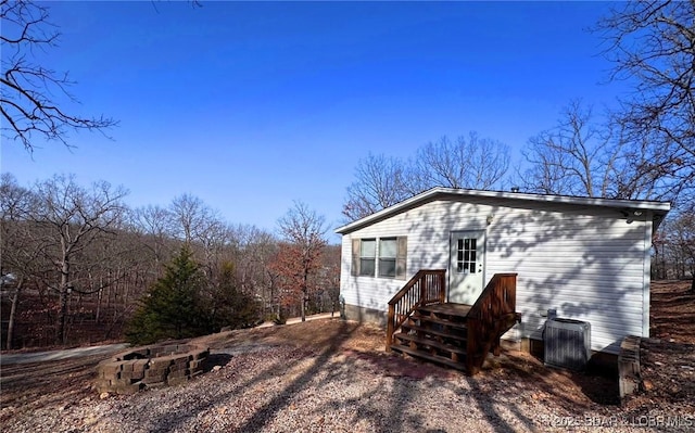 rear view of house with central AC