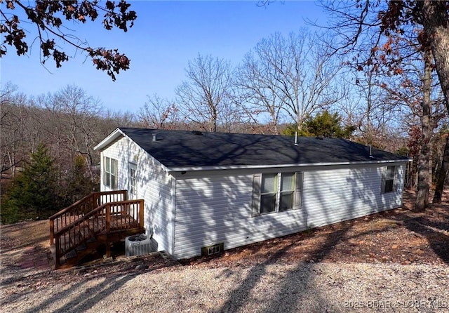 view of property exterior with central AC unit