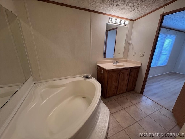 full bath featuring ornamental molding, a textured ceiling, tile patterned flooring, a bath, and vanity