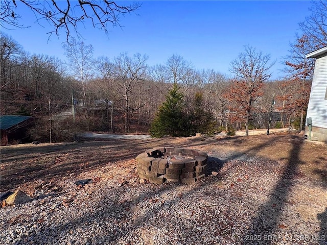 view of yard featuring a fire pit