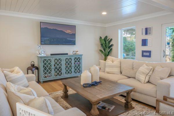 living room with recessed lighting, wood finished floors, and crown molding