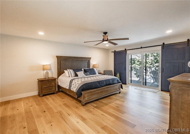 bedroom featuring baseboards, recessed lighting, a barn door, access to outside, and light wood-type flooring