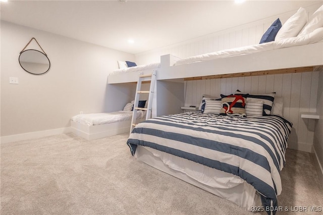 bedroom with baseboards and carpet