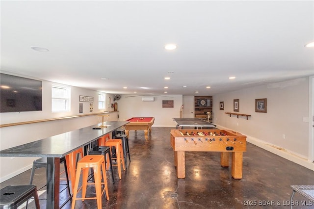 game room featuring recessed lighting, concrete flooring, and baseboards