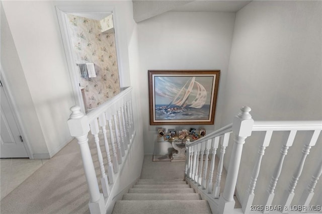 stairs with tile patterned floors