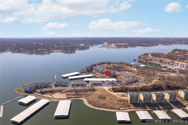 birds eye view of property featuring a water view