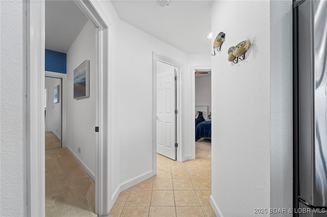 68 Lighthouse Rd Unit 344, Lake Ozark, MO 65049 - hallway featuring light tile patterned floors and baseboards