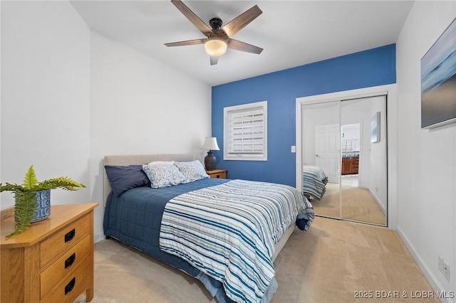 bedroom featuring baseboards, light carpet, and ceiling fan