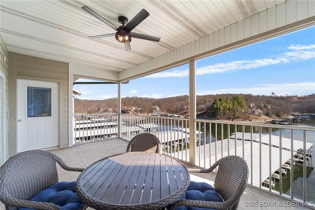 68 Lighthouse Rd Unit 344, Lake Ozark, MO 65049 - balcony with a ceiling fan, a water view, and outdoor dining space