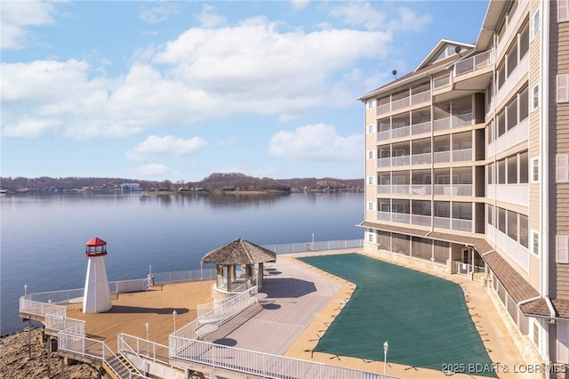 exterior space featuring a gazebo and a water view