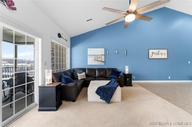 living room featuring visible vents, high vaulted ceiling, a ceiling fan, carpet floors, and baseboards