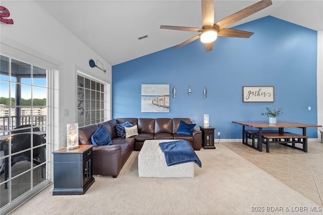 68 Lighthouse Rd Unit 344, Lake Ozark, MO 65049 - carpeted living room featuring a ceiling fan, baseboards, tile patterned flooring, and high vaulted ceiling