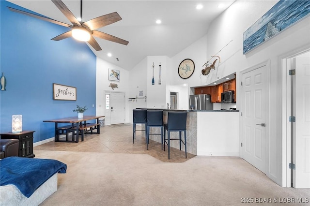 68 Lighthouse Rd Unit 344, Lake Ozark, MO 65049 - living area featuring high vaulted ceiling, light carpet, ceiling fan, recessed lighting, and baseboards