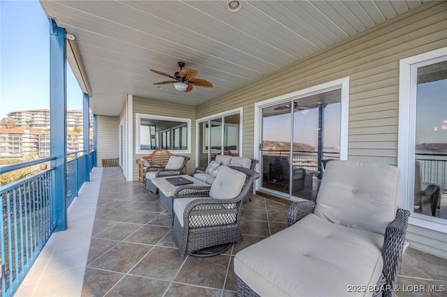 view of patio featuring outdoor lounge area, a balcony, and ceiling fan