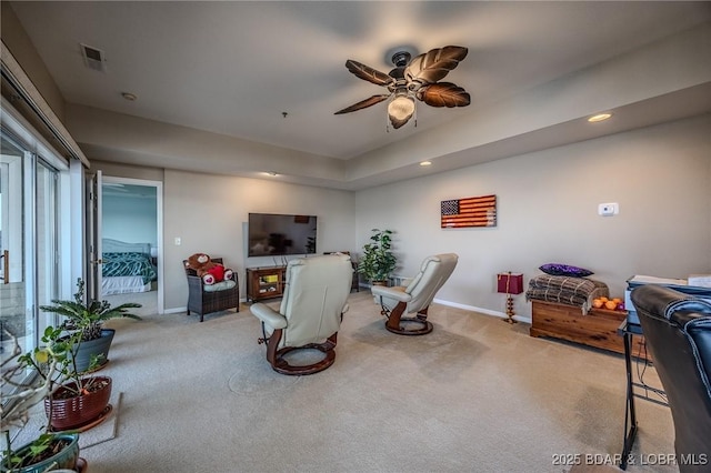 carpeted living area featuring visible vents, recessed lighting, baseboards, and ceiling fan