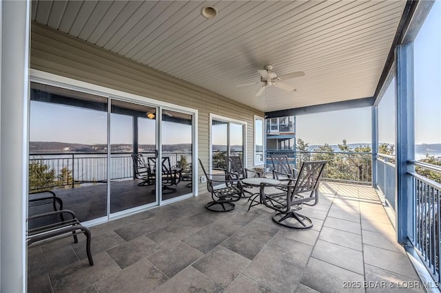 exterior space featuring a balcony and ceiling fan