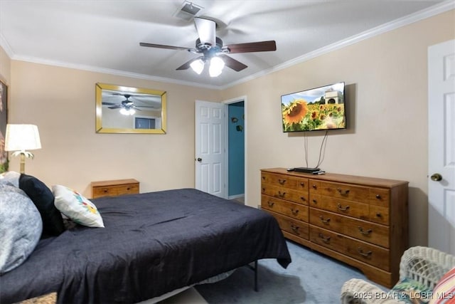 carpeted bedroom with a ceiling fan and crown molding