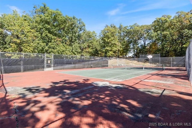 view of sport court with fence