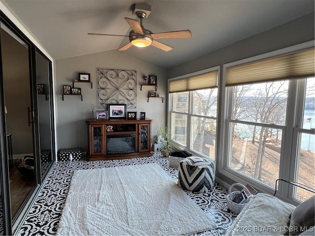 sitting room featuring a ceiling fan and vaulted ceiling