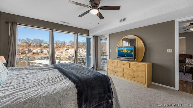 bedroom with access to outside, baseboards, visible vents, and light carpet