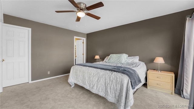 bedroom featuring light colored carpet, baseboards, and ceiling fan