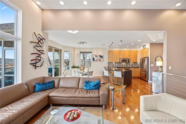 145 Bella Terra Ct, Sunrise Beach, MO 65079 - living room featuring light wood finished floors, recessed lighting, and baseboards