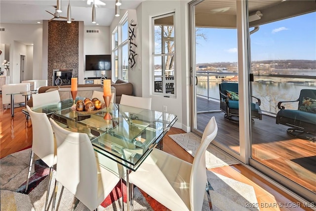 145 Bella Terra Ct, Sunrise Beach, MO 65079 - dining area featuring visible vents, baseboards, and wood finished floors