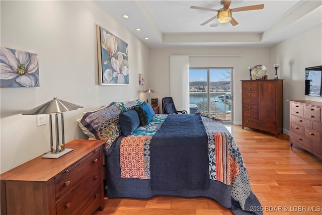 145 Bella Terra Ct, Sunrise Beach, MO 65079 - bedroom with baseboards, light wood-style flooring, recessed lighting, ceiling fan, and a raised ceiling
