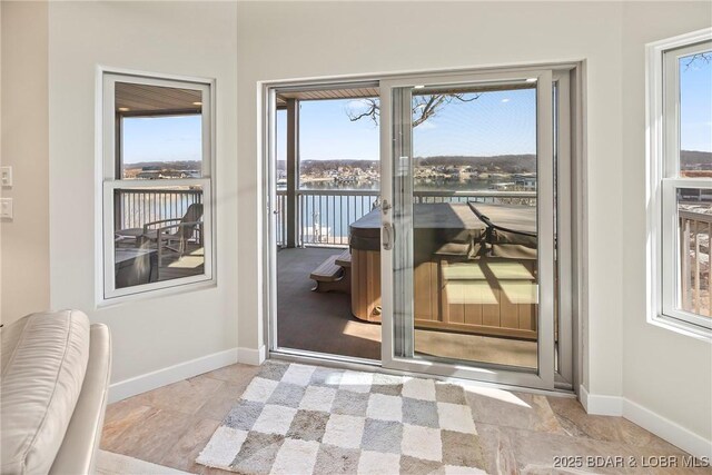 145 Bella Terra Ct, Sunrise Beach, MO 65079 - doorway with baseboards and a water view