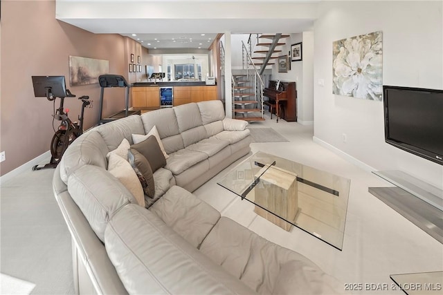 145 Bella Terra Ct, Sunrise Beach, MO 65079 - carpeted living area featuring stairway, wine cooler, and baseboards