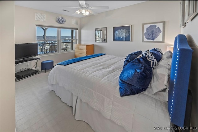 145 Bella Terra Ct, Sunrise Beach, MO 65079 - bedroom with tile patterned floors, visible vents, and ceiling fan
