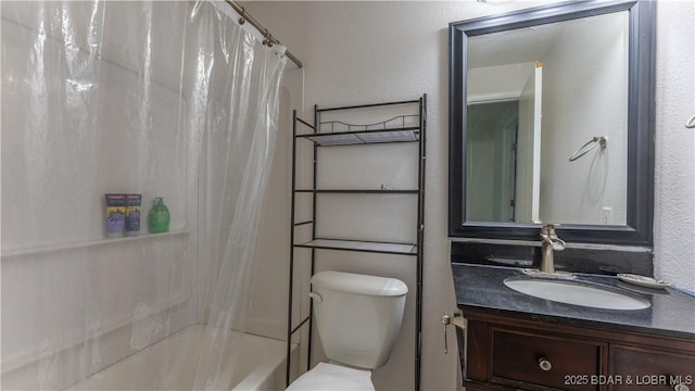 full bath featuring vanity, shower / bathtub combination with curtain, and toilet