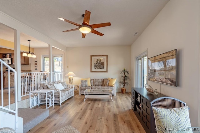 889 Malibu Rd Unit 91, Osage Beach, MO 65065 - living room featuring a ceiling fan and light wood-style flooring