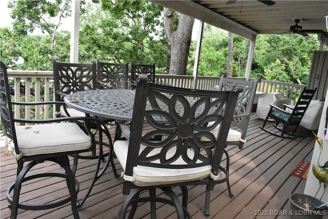 889 Malibu Rd Unit 91, Osage Beach, MO 65065 - wooden terrace with outdoor dining area and a ceiling fan