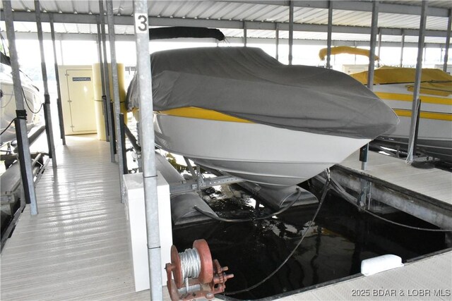 889 Malibu Rd Unit 91, Osage Beach, MO 65065 - dock area featuring boat lift