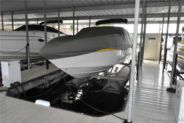 889 Malibu Rd Unit 91, Osage Beach, MO 65065 - dock area featuring boat lift