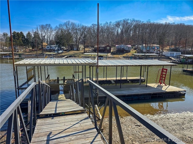 dock area featuring a water view and boat lift