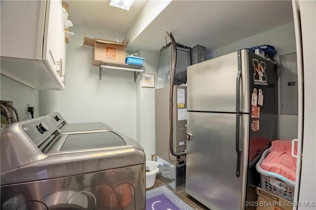 2813 Great Lake View Dr, Gravois Mills, MO 65037 - laundry room featuring cabinet space, washer and dryer, and electric panel