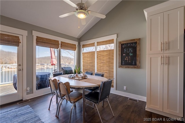 2813 Great Lake View Dr, Gravois Mills, MO 65037 - dining room featuring dark wood-type flooring, plenty of natural light, ceiling fan, and high vaulted ceiling
