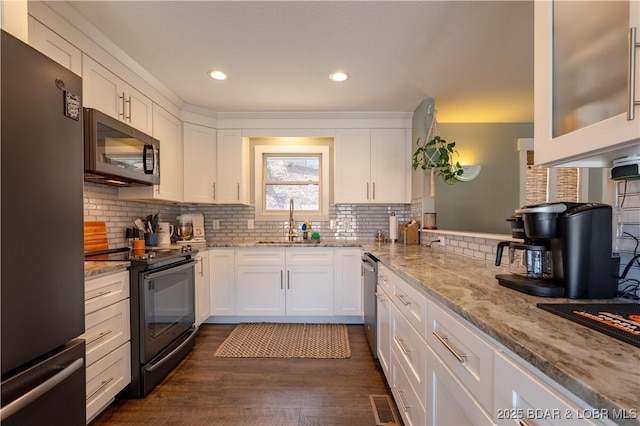 2813 Great Lake View Dr, Gravois Mills, MO 65037 - kitchen featuring freestanding refrigerator, black range with electric cooktop, white cabinetry, dark wood finished floors, and tasteful backsplash