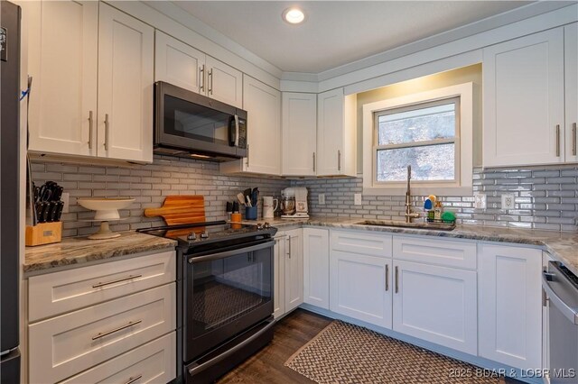 2813 Great Lake View Dr, Gravois Mills, MO 65037 - kitchen with black range with electric cooktop, dishwasher, white cabinets, backsplash, and recessed lighting