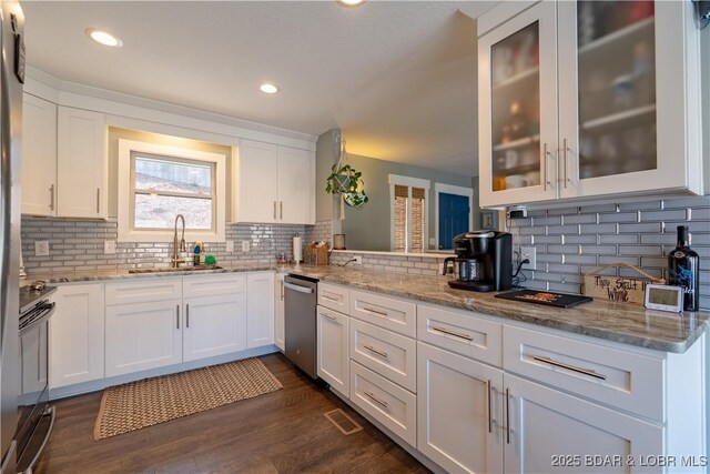 2813 Great Lake View Dr, Gravois Mills, MO 65037 - kitchen featuring dishwasher, decorative backsplash, white cabinets, light stone countertops, and recessed lighting