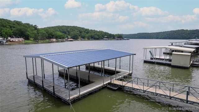 2813 Great Lake View Dr, Gravois Mills, MO 65037 - dock area featuring a water view and a wooded view